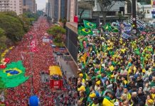Ações políticas contrastantes em São Paulo marcam véspera do segundo turno presidencial Manifestantes na Avenida Paulista durante atos políticos em São Paulo em outubro de 2026, representando grupamentos distintos em manifestações pró-Lula e pró-Flávio Bolsonaro.