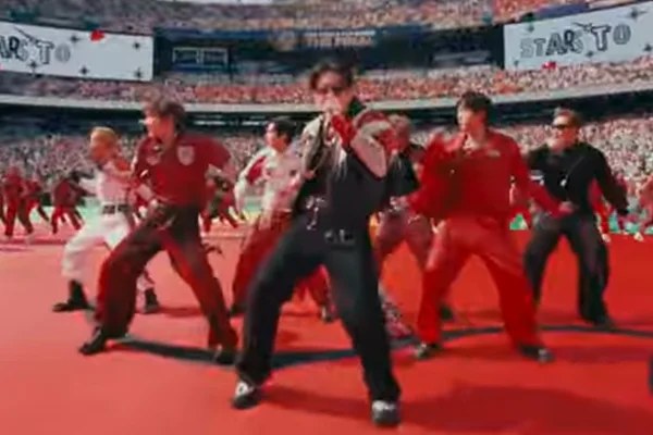 expresso-d08b64da66c62a4bd62ce3ff Imagem do grupo BTS durante apresentação em evento internacional